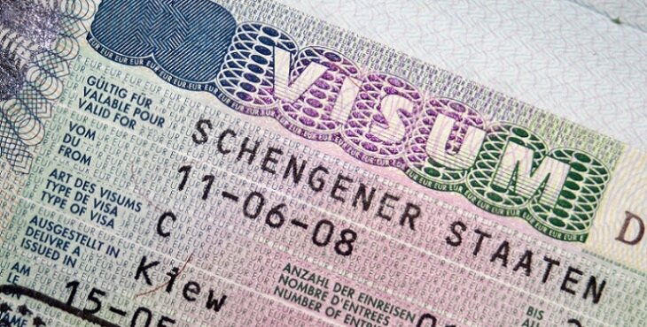 Close-up page of passport with Schengen visa